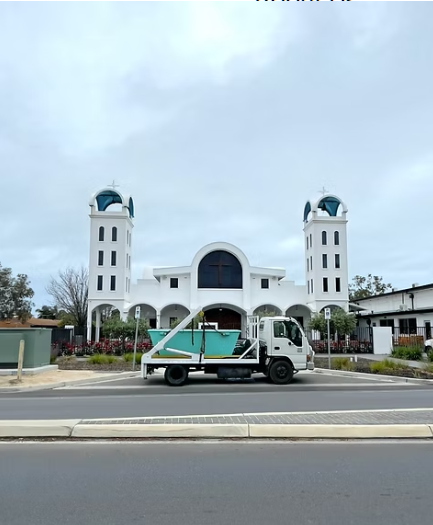 Adelaide Skip Bins truck delivering skip bin in Port Adelaide - family-owned local waste removal service